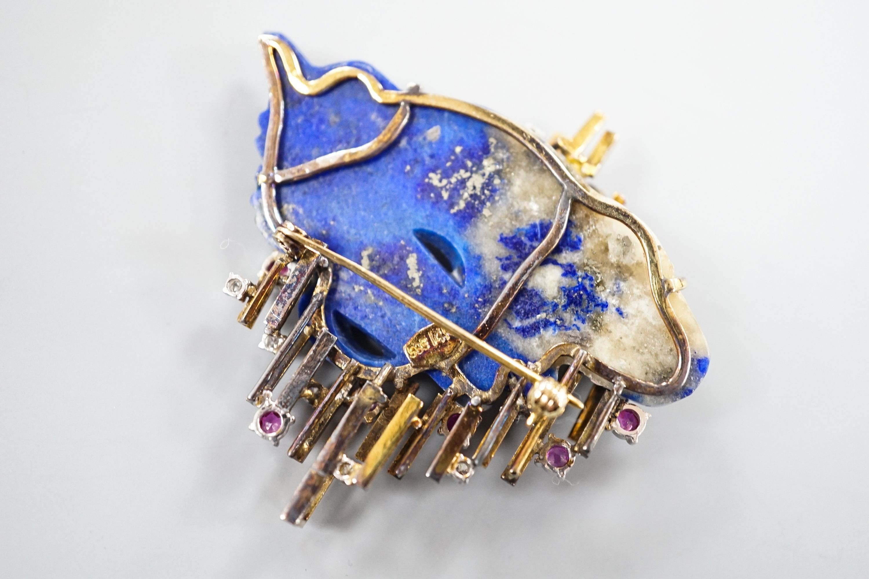 A 585 yellow metal, ruby, diamond and apis lazuli set modernist brooch, maker's mark KK, width 52mm, gross weight 21.4 grams